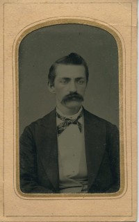 Man in mustache crisscross tie lo-res