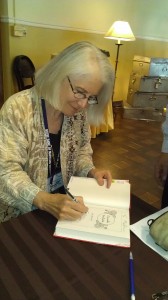 Signing books at FWS auction